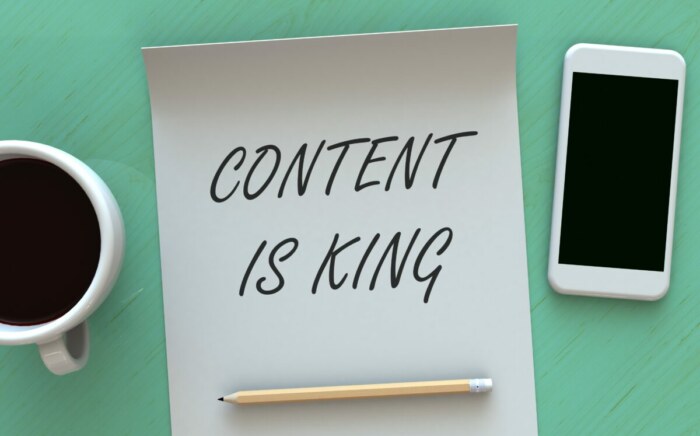 Paper, smartphone, and coffee table - Content is King